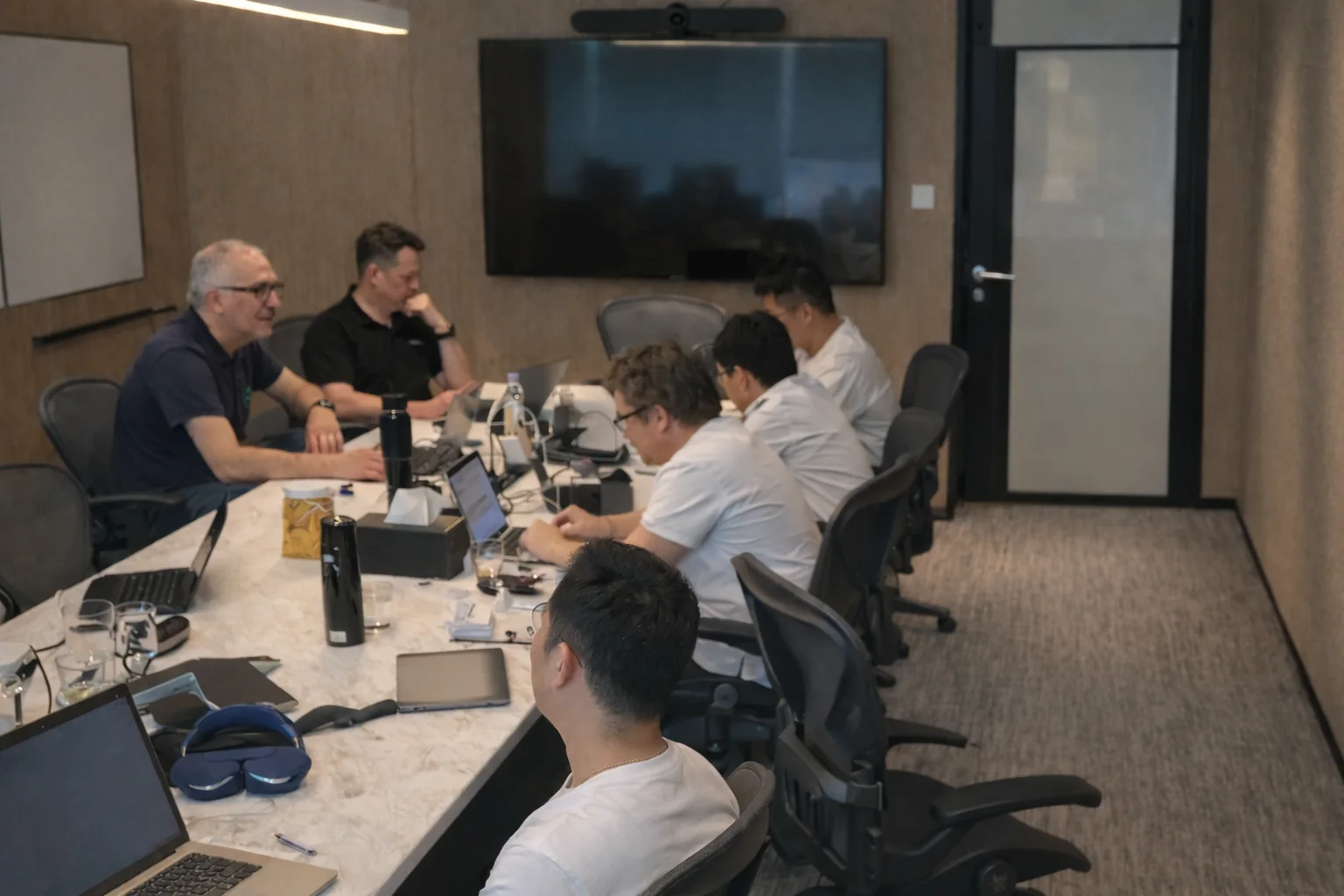 Engineers collaborating around a conference table during a Lovepop product workshop